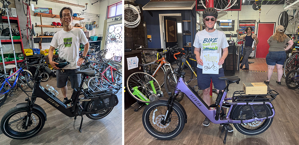 Two people pose with e-bikes. The man on the left wears a t-shirt saying, "I love my bike" and the woman on the right wears a t-shirt saying, "Bike Your City."